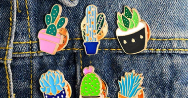 Branded soft enamel pins by creative branding agency Tetra Brands